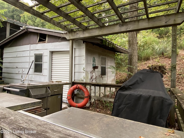 682 Hornback Mill Ln, Leitchfield, KY 42754 - wooden terrace with area for grilling, a pergola, and a sink