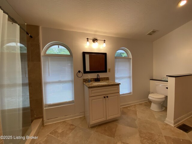 682 Hornback Mill Ln, Leitchfield, KY 42754 - full bathroom with toilet, baseboards, a shower with curtain, vanity, and a textured ceiling