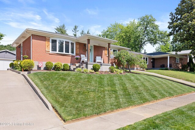 7513 Merlyn Cir, Louisville, KY 40214 - view of front of property with brick siding, an outdoor structure, a porch, and a front yard