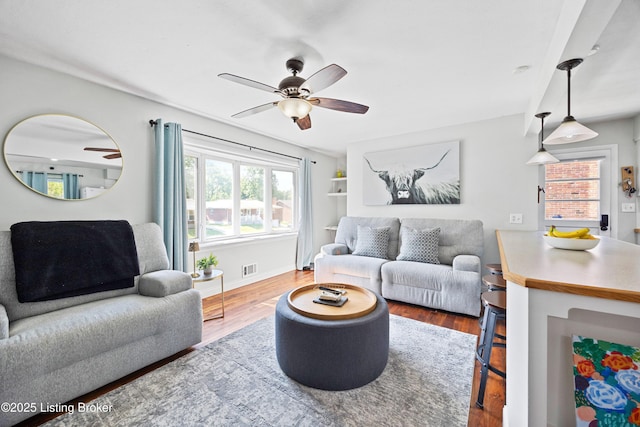 7513 Merlyn Cir, Louisville, KY 40214 - living area with ceiling fan, wood finished floors, and baseboards