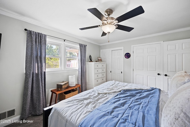 7513 Merlyn Cir, Louisville, KY 40214 - bedroom featuring carpet, ornamental molding, multiple closets, and ceiling fan