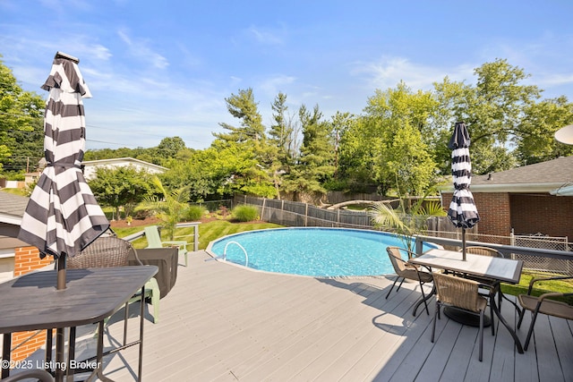 7513 Merlyn Cir, Louisville, KY 40214 - view of swimming pool featuring outdoor dining space, a deck, and a fenced backyard