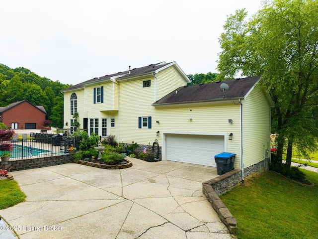 4011 Serendipity Ln, Louisville, KY 40272 - back of property featuring concrete driveway and an attached garage