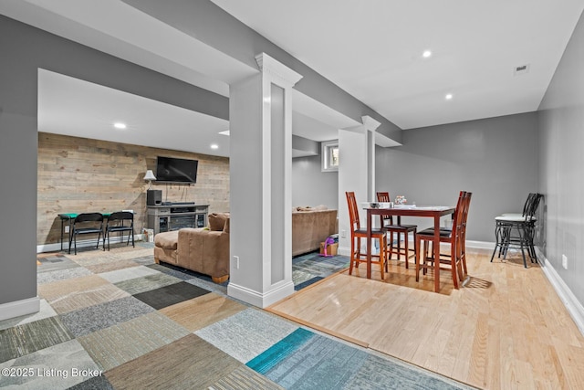 4011 Serendipity Ln, Louisville, KY 40272 - dining area featuring wood finished floors, baseboards, recessed lighting, wooden walls, and a fireplace