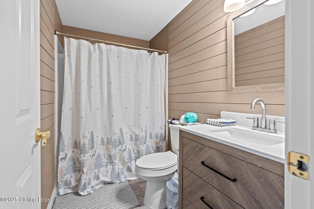 4011 Serendipity Ln, Louisville, KY 40272 - bathroom featuring wooden walls, vanity, toilet, and a shower with shower curtain