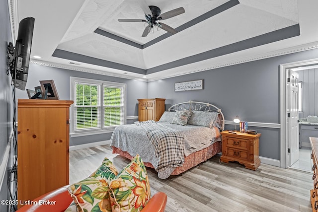 4011 Serendipity Ln, Louisville, KY 40272 - bedroom featuring a tray ceiling, light wood-style flooring, and baseboards