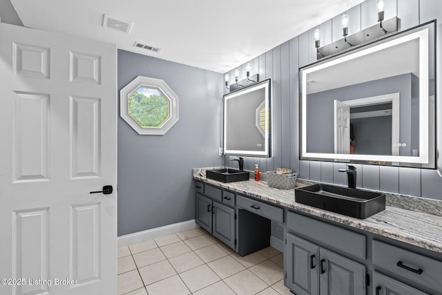 4011 Serendipity Ln, Louisville, KY 40272 - full bathroom with double vanity, tile patterned floors, and baseboards