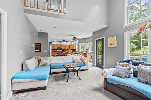 4011 Serendipity Ln, Louisville, KY 40272 - living room featuring light colored carpet, a towering ceiling, and ceiling fan