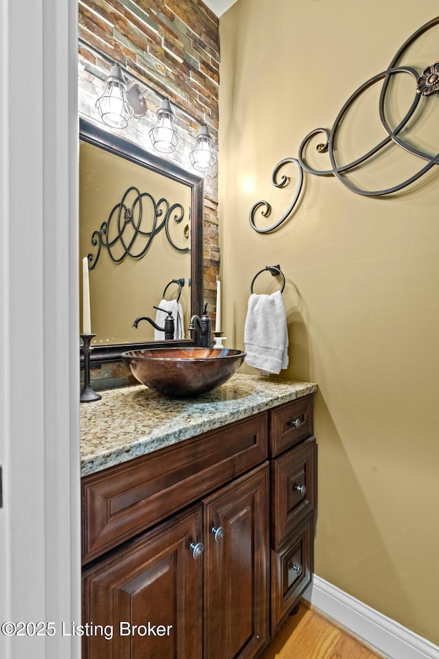 4011 Serendipity Ln, Louisville, KY 40272 - bathroom with vanity, wood finished floors, and baseboards