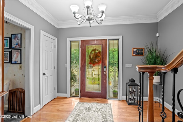 4011 Serendipity Ln, Louisville, KY 40272 - foyer entrance with a chandelier, wood finished floors, crown molding, and baseboards