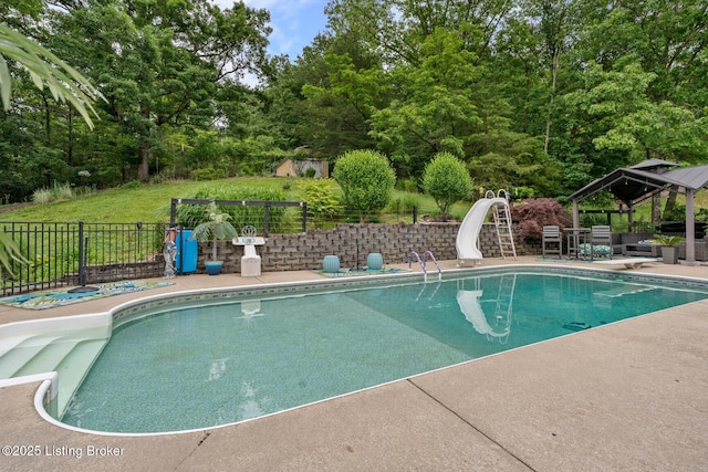 4011 Serendipity Ln, Louisville, KY 40272 - view of swimming pool with a water slide, a gazebo, a patio area, and view of wooded area