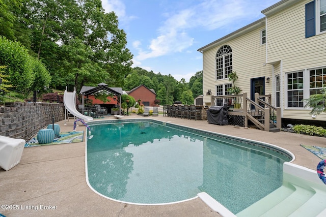 4011 Serendipity Ln, Louisville, KY 40272 - view of swimming pool featuring a gazebo, a water slide, a patio, and a wooden deck