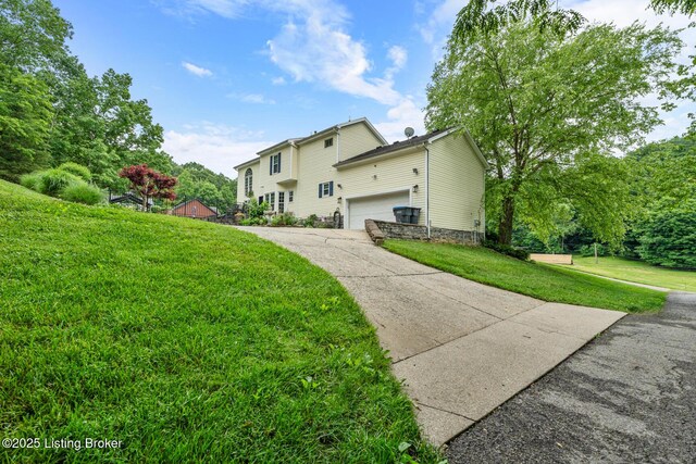 4011 Serendipity Ln, Louisville, KY 40272 - view of home's exterior featuring driveway, a garage, and a yard
