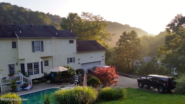 4011 Serendipity Ln, Louisville, KY 40272 - rear view of house featuring an outdoor pool and a patio area