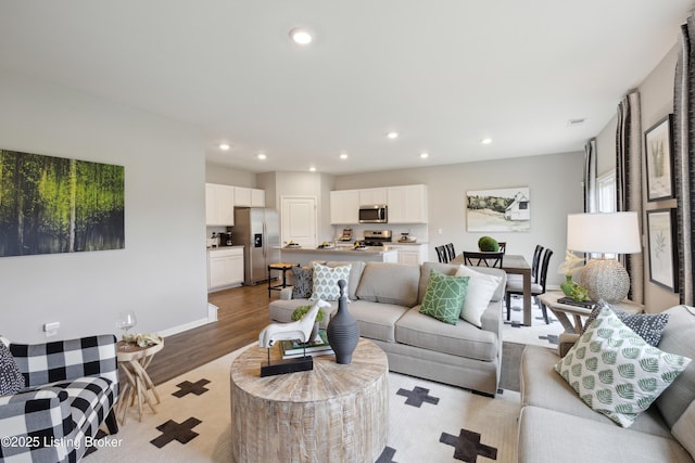 11033 Pheasant Hill Cir, Louisville, KY 40229 - living room with recessed lighting, wood finished floors, and baseboards
