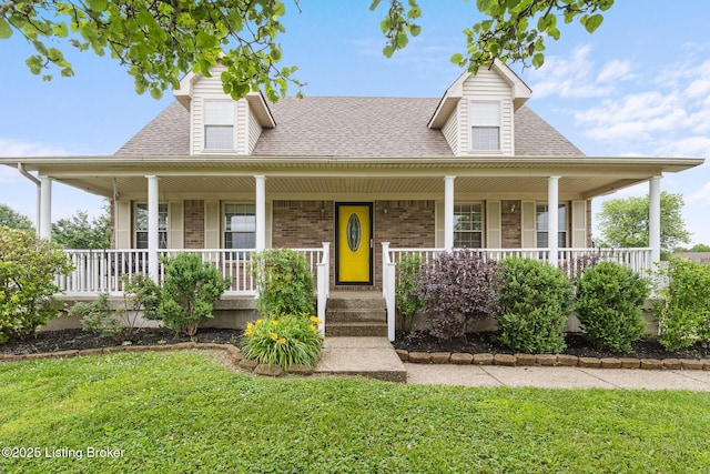 5704 Bartview Ct, Louisville, KY 40229 - farmhouse inspired home with roof with shingles, brick siding, a porch, and a front yard