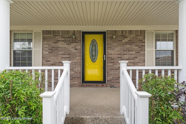 5704 Bartview Ct, Louisville, KY 40229 - view of exterior entry with a porch and brick siding