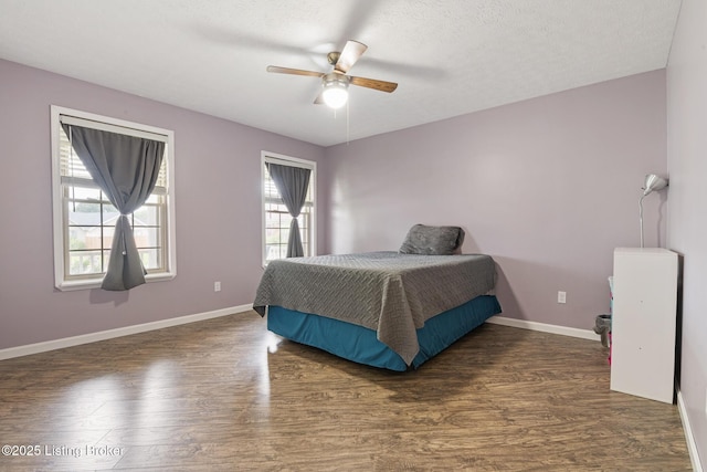 5704 Bartview Ct, Louisville, KY 40229 - bedroom with wood finished floors, baseboards, ceiling fan, and a textured ceiling