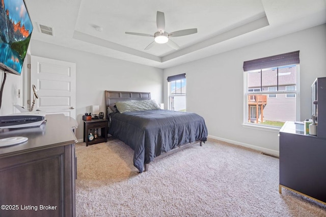 10905 Hidden Trail Ct, Louisville, KY 40229 - bedroom featuring a raised ceiling, light carpet, baseboards, and a ceiling fan