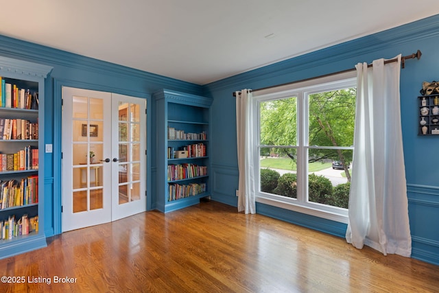 3908 Keal Run Way, Louisville, KY 40241 - spare room featuring french doors, ornamental molding, wood finished floors, and built in shelves