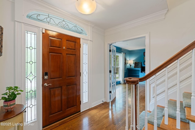 3908 Keal Run Way, Louisville, KY 40241 - entryway with wood finished floors, ornamental molding, stairs, plenty of natural light, and baseboards
