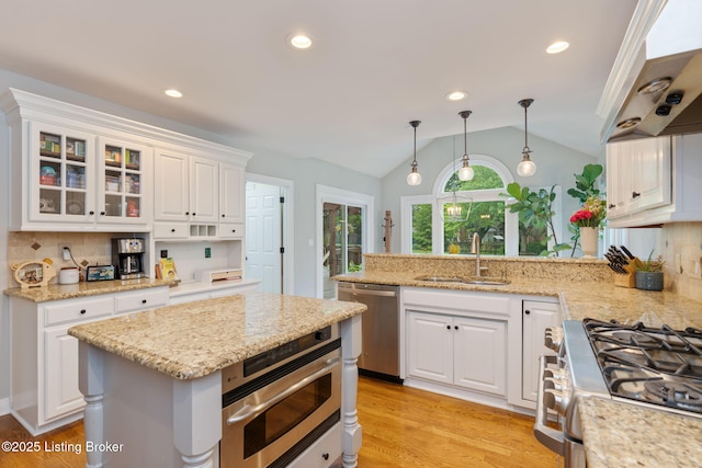 3908 Keal Run Way, Louisville, KY 40241 - kitchen with a sink, stainless steel appliances, vaulted ceiling, white cabinets, and backsplash