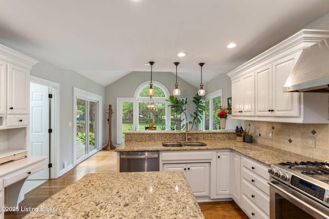3908 Keal Run Way, Louisville, KY 40241 - kitchen featuring a sink, appliances with stainless steel finishes, lofted ceiling, white cabinetry, and wood finished floors