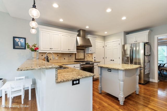 3908 Keal Run Way, Louisville, KY 40241 - kitchen with wall chimney range hood, appliances with stainless steel finishes, a sink, a peninsula, and white cabinetry