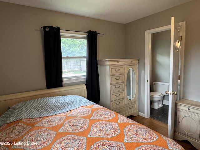 7005 Shareith Dr, Louisville, KY 40228 - bedroom with wood finished floors, ensuite bathroom, and baseboards