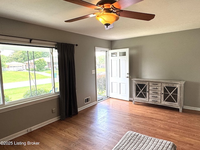 7005 Shareith Dr, Louisville, KY 40228 - spare room featuring baseboards, wood finished floors, and ceiling fan