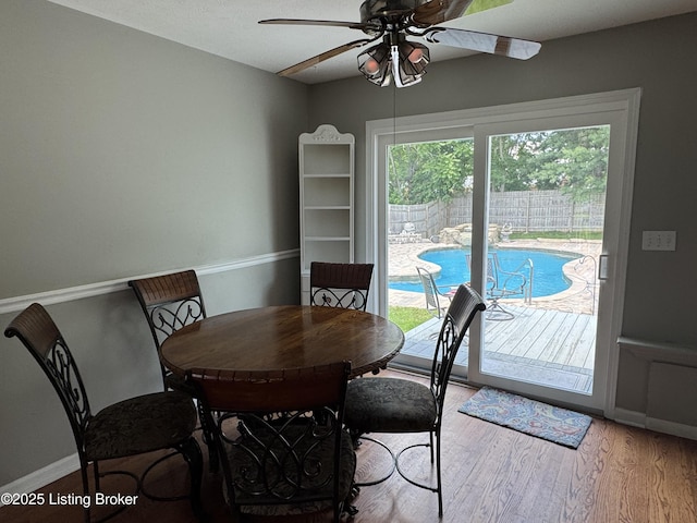 7005 Shareith Dr, Louisville, KY 40228 - dining area with ceiling fan, wood finished floors, and baseboards