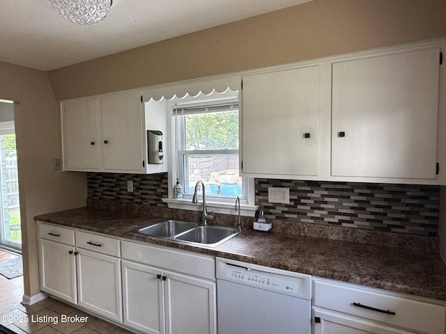 7005 Shareith Dr, Louisville, KY 40228 - kitchen featuring white dishwasher, a sink, white cabinetry, and dark countertops