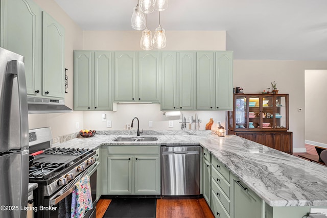 920 Lydia St, Louisville, KY 40217 - kitchen with appliances with stainless steel finishes, under cabinet range hood, a peninsula, green cabinets, and light stone counters
