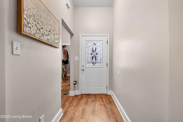920 Lydia St, Louisville, KY 40217 - doorway with light wood-style flooring and baseboards