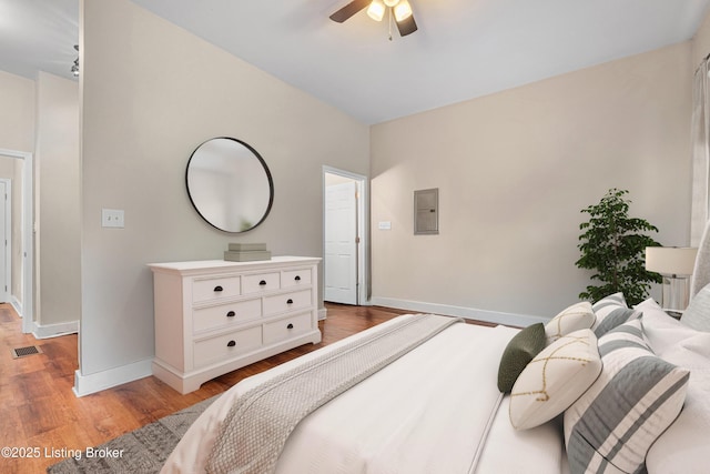 920 Lydia St, Louisville, KY 40217 - bedroom featuring electric panel, light wood-style floors, and a ceiling fan