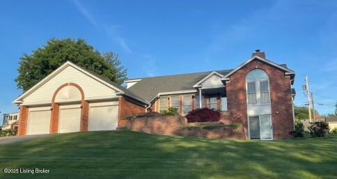 123 Westwind Trl, Bardstown, KY 40004 - ranch-style home featuring a front lawn, an attached garage, driveway, and a chimney