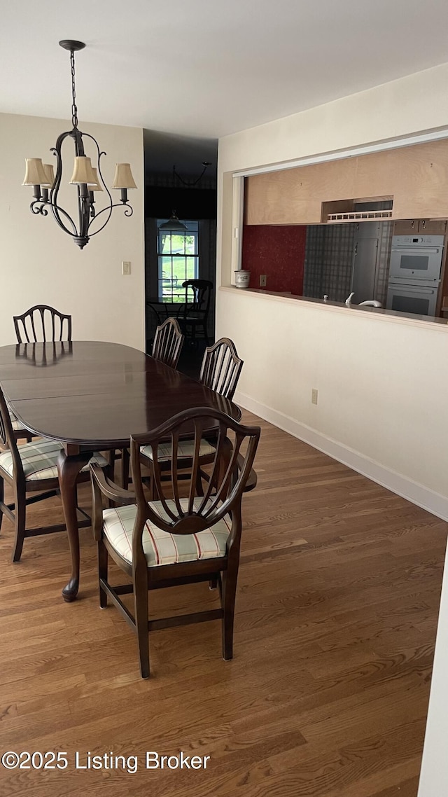 123 Westwind Trl, Bardstown, KY 40004 - dining room with a chandelier, wood finished floors, and baseboards
