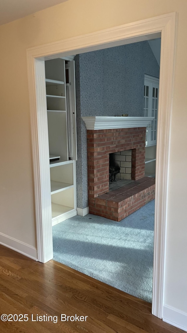 123 Westwind Trl, Bardstown, KY 40004 - unfurnished living room featuring baseboards, wood finished floors, and a fireplace