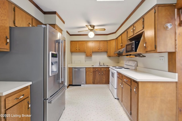 2806 Girard Dr, Louisville, KY 40213 - kitchen with appliances with stainless steel finishes, crown molding, ceiling fan, brown cabinetry, and under cabinet range hood