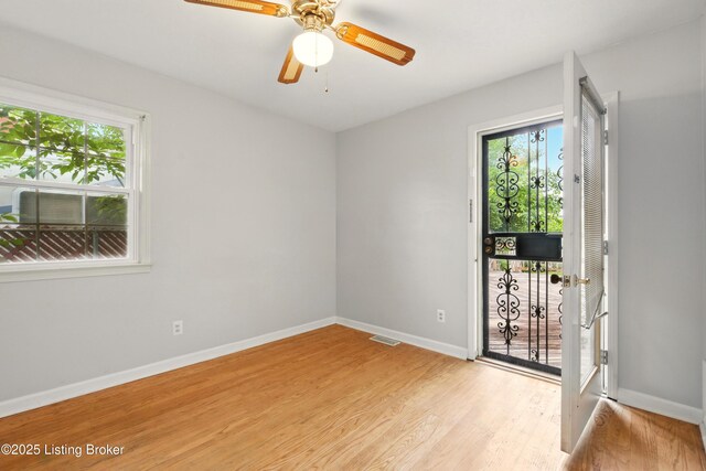 2806 Girard Dr, Louisville, KY 40213 - unfurnished room with light wood-style floors, baseboards, and ceiling fan