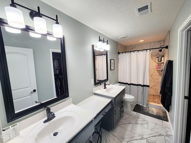 202 Elizabeth Way, Bardstown, KY 40004 - bathroom with marble finish flooring, tiled shower, vanity, a textured ceiling, and toilet