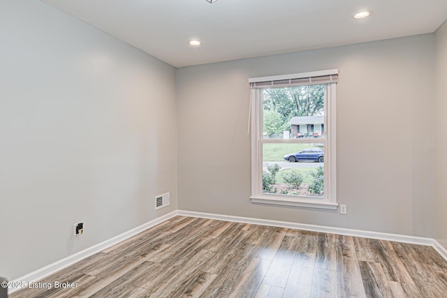 1507 Glenrock Rd, Louisville, KY 40216 - empty room with wood finished floors, baseboards, and recessed lighting