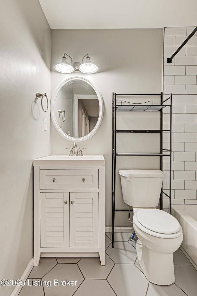 1507 Glenrock Rd, Louisville, KY 40216 - bathroom with vanity, toilet, baseboards, tile patterned flooring, and shower / bathtub combination