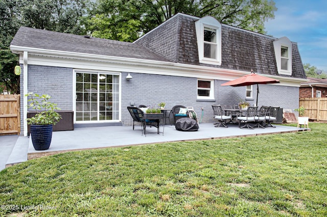 1507 Glenrock Rd, Louisville, KY 40216 - rear view of house featuring brick siding, a patio, mansard roof, and roof with shingles