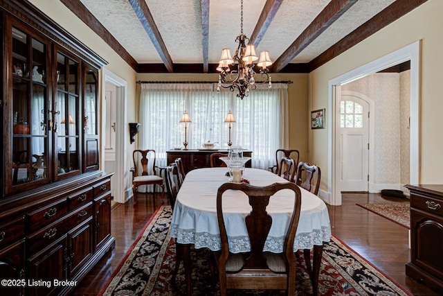 916 Audubon Pkwy, Audubon Park, KY 40213 - dining area with a chandelier, dark wood finished floors, beam ceiling, baseboards, and a textured ceiling