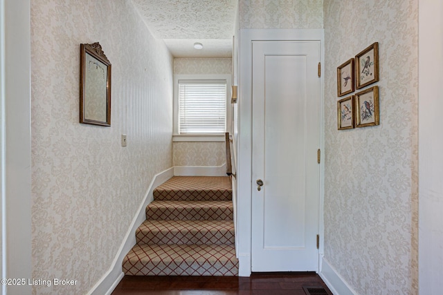 916 Audubon Pkwy, Audubon Park, KY 40213 - stairs featuring wallpapered walls and wood finished floors