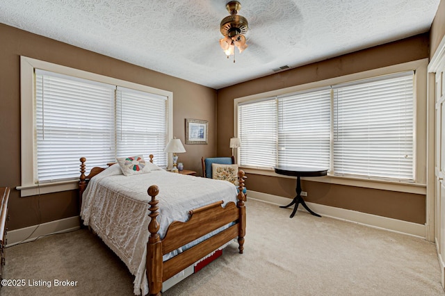 916 Audubon Pkwy, Audubon Park, KY 40213 - bedroom with baseboards, light colored carpet, a textured ceiling, and ceiling fan