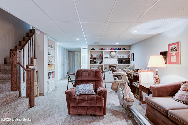 916 Audubon Pkwy, Audubon Park, KY 40213 - living room with carpet floors, stairway, recessed lighting, a drop ceiling, and built in features