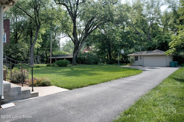 916 Audubon Pkwy, Audubon Park, KY 40213 - view of grassy yard featuring an outbuilding, a detached garage, view of scattered trees, and stairway