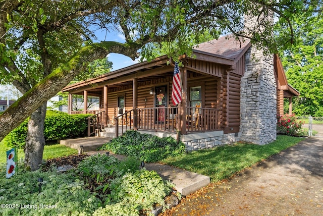 3804 Grassy Creek Dr, Lexington, KY 40503 - log cabin featuring covered porch and log exterior